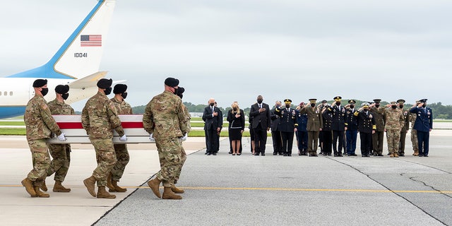 A U.S. Army carry team transfers Ryan's remains Aug. 29, 2021, at Dover Air Force Base, Delaware. 