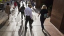 People walking down a sidewalk.