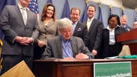 Snyder signs $1.3 billion plan to mend Michigan roads, transit; fate rests with voters in May