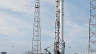 SpaceX to try again Saturday to launch space station supplies, land booster rocket on platform