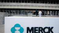 Merck swings to 3Q loss on big charge but raises forecast