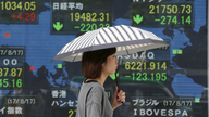 Asian shares slide as Wall Street fall, Spain attack weigh