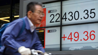 Global stocks mostly slide after disappointing Chinese data