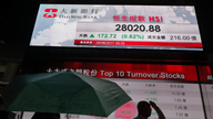 Asian shares mixed, US storm sends gasoline futures spiking