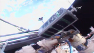 Spacewalking cosmonauts release 3-D-printed satellite