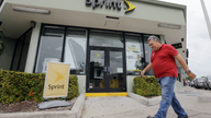 Sprint posts rare profit, says a deal may be coming soon