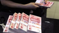 Chinese Yuan Slips, Stocks Stage Late Rally