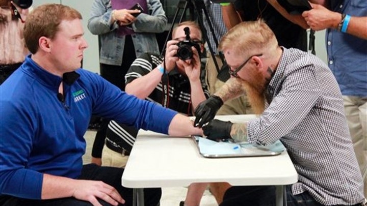 SWEDISH COMPANY SHOWCASES MICROCHIP THAT CAN DOWNLOAD COVID-19 PASSPORT STATUS SWEDISH COMPANY SHOWCASES MICROCHIP THAT CAN DOWNLOAD COVID-19 PASSPORT STATUS