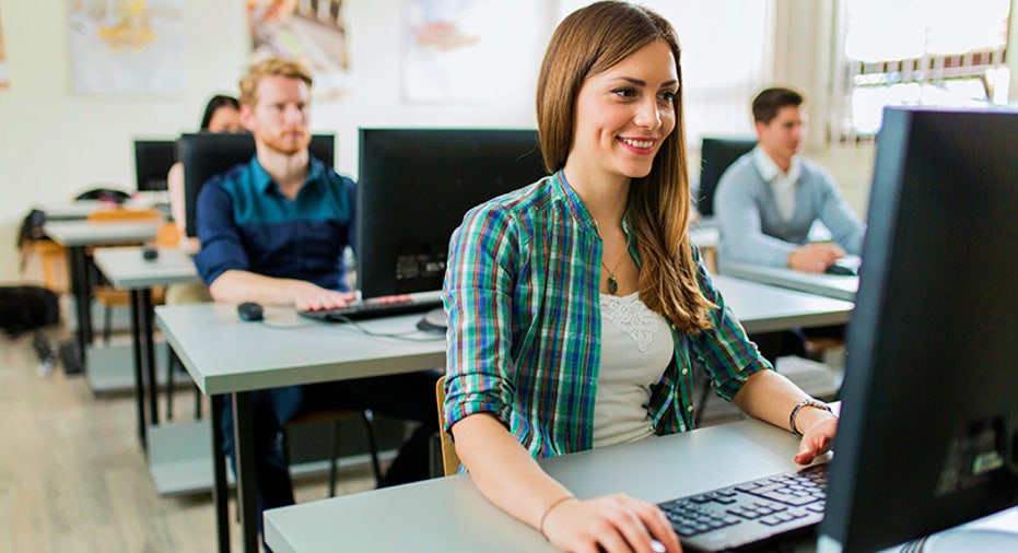 Young beautiful girl working on a computer