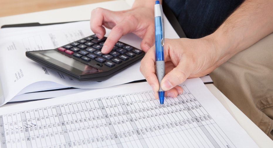 Young couple calculating budget