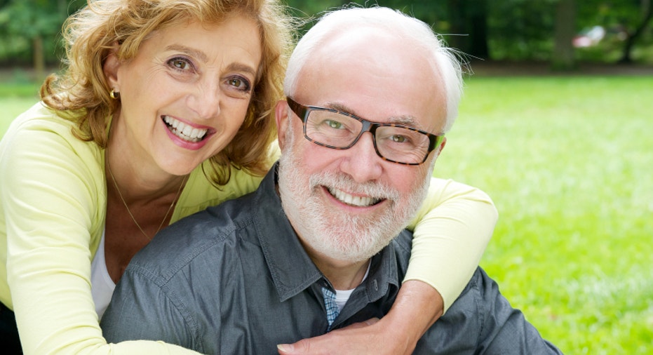 Happy older couple smiling  and showing affection