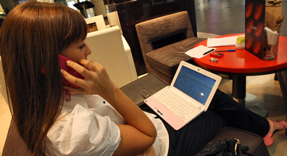 Netbook Laptop Computer Woman on Phone at Cafe FBN