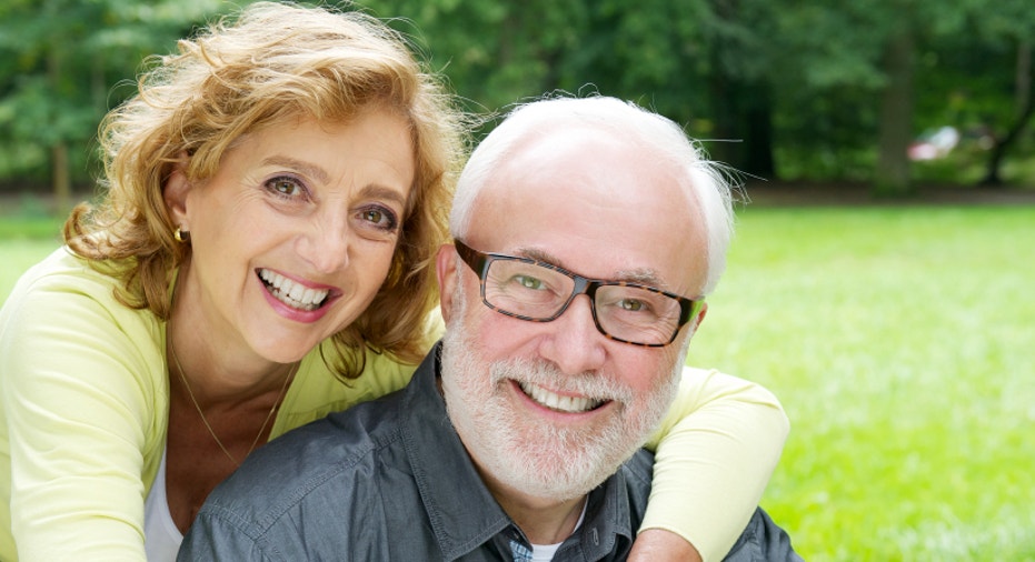 Happy older couple smiling  and showing affection