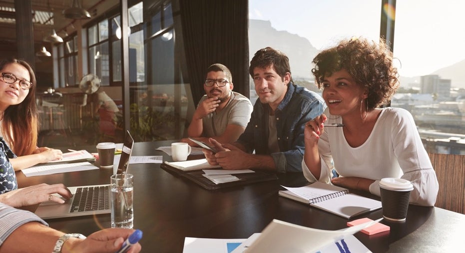 Team Of Young People Discussing New Business Plan