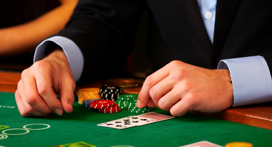 Dealer handling cards at a casino