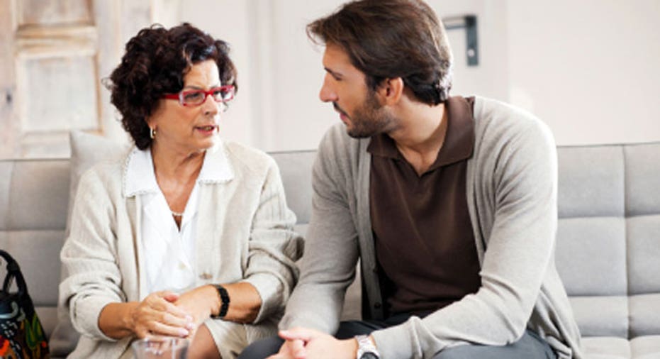 Senior adult woman talking to her son.