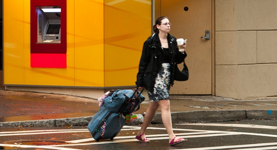 woman with suitcase walking