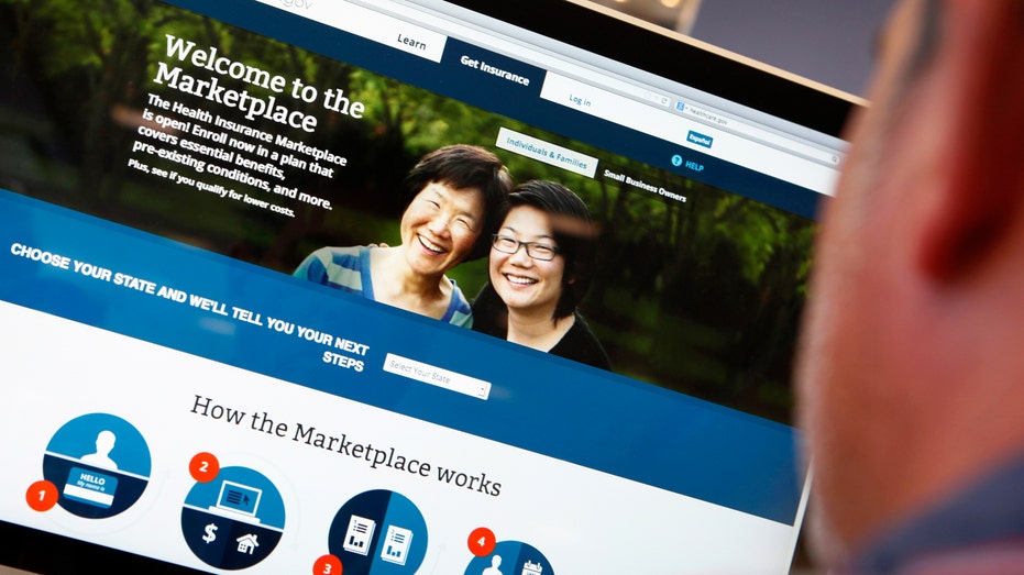 A man looks over the Affordable Care Act (commonly known as ObamaCare) signup page on the HealthCare.gov website in New York.