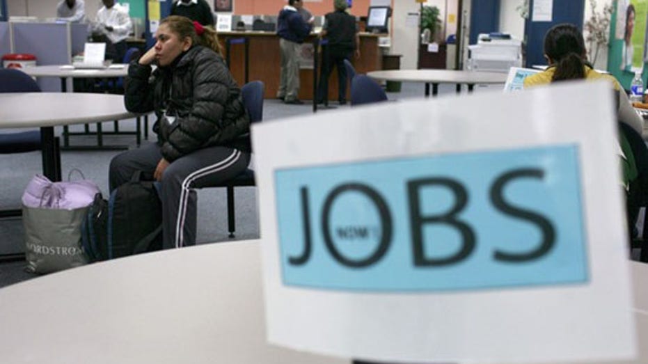 Job seekers visit an employment center in San Francisco, California, in this Nov. 20, 2009, file photo. 