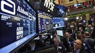 Wall Street Slips with Healthcare Stocks, Nasdaq Flat