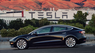 Tesla delivers first lower-cost Model 3 cars