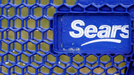 Aggressive cost-cutting helps Sears narrow loss; shares rise