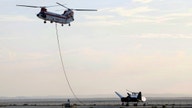 Dream Chaser spacecraft in captive-carry test over desert