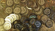 Bitcoin hits new record high as warnings grow louder