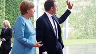 The Latest: Merkel says countries will work with US