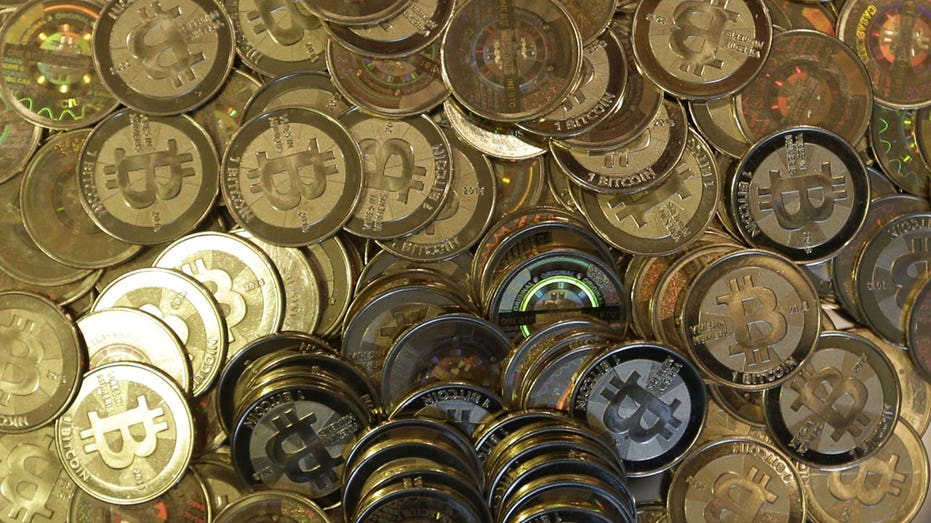 Bitcoins in a pile AP FBN