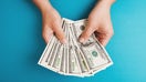 Man counting money, economy concept, allocation of money - Fox Business News