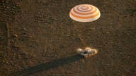Happy landings: 3 space station crew members back on Earth