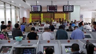 China Shares Close Up After Muted Inflation Data
