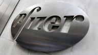 Pfizer, riding tax changes, puts up huge 4Q profit