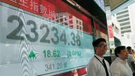 Asian shares mostly down on worries about global growth, Fed