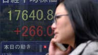 Asian shares mostly lower, Nikkei gets boost from weak yen