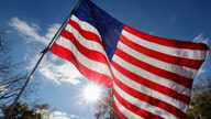 US laundry business cleans, mends American flags for free