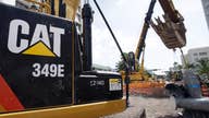 Caterpillar warns global economic tremors will curb sales