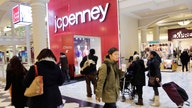 JC Penney shrinks loss, shares spike