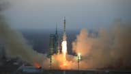 China launches manned mission to experimental space station