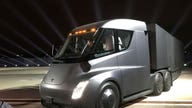 Tesla unveils electric big-rig truck in midst of Model 3 factory 'hell'