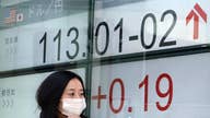 Asian shares mostly higher on strong manufacturing data