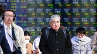 Asian shares mixed after Nasdaq hits record high