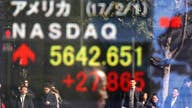 Asian shares slip, dollar wobbles as Fed keeps rates steady