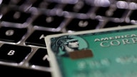 AmEx posts first loss in 26 years on tax charge, suspends buybacks