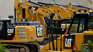 Caterpillar posts 4Q loss on tax charge, but adjusted EPS up