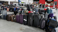 The Latest: JFK airlines told to get bags to owners faster