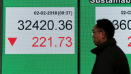 Asian shares lower as investors mull earnings, yields weigh