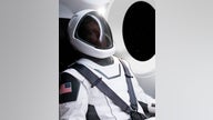 SpaceX unveils sleek, white spacesuit for astronaut travel