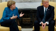 Merkel pushes back against renewed Trump criticism of surplus